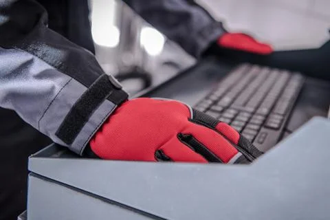 Car Diagnostic Computer. Auto Service Worker Hands on Computer Keyboard. Stock Photos