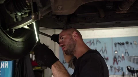 Car diagnostics. an auto mechanic inspects a car. auto repair shop. breaking. Видео 204083055