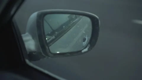 Car with dirty side view mirror driving fast on highway Video stock 164548787