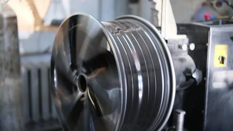 Car disk spinning on repair machine, close-up Stock Footage 306882906