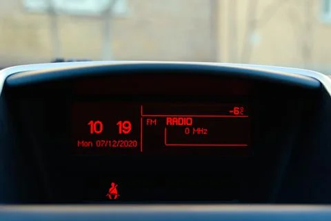 Car display with date time temperature and FM radio switched on Stock Photos