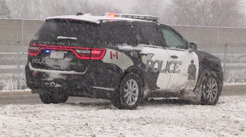 Car in ditch in severe snow storm and blizzard Stock Footage 44979254