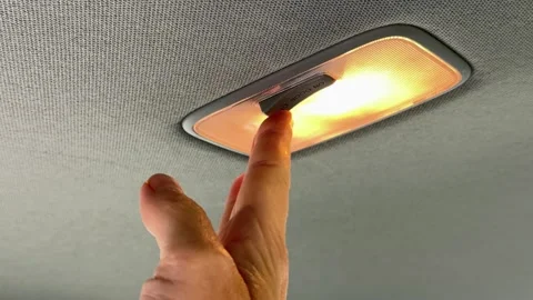 Car-dome-light-switch-hand Stock Footage 340359255