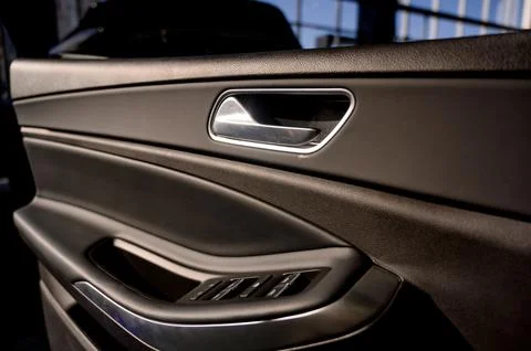Car door with door handle and window control and adjustment button Photos