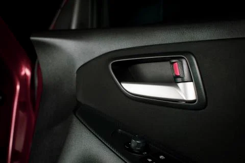 Car door lock / unlock button and metallic handle. Stock Photos