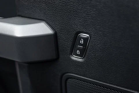 Car door lock unlock button close up. Electric central locking button in mode Stock Photos