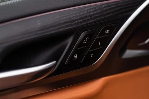 Car door lock unlock button close up. Modern car door lock. Door control pane Stock Photos