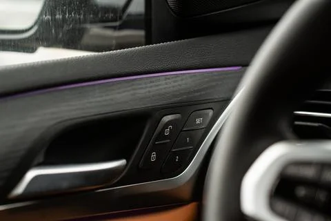 Car door lock unlock button close up. Modern car door lock. Door control pane Photos