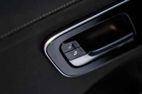 Car door lock unlock button close up. Modern car door lock. Door control pane Foto stock