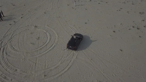 Car drifting on a desert Stock Footage