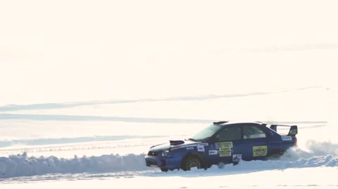 Car drifting on the snowing road in the race Stock Footage 59647862