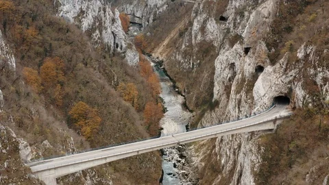 Car drive on the bridge in the gorge Stock Footage 114974575
