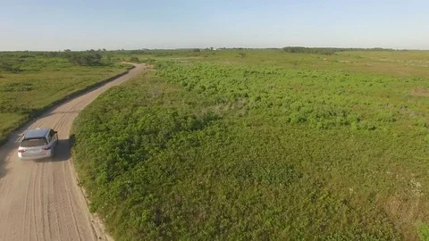 Car drive off into distance Stock Footage 78771580