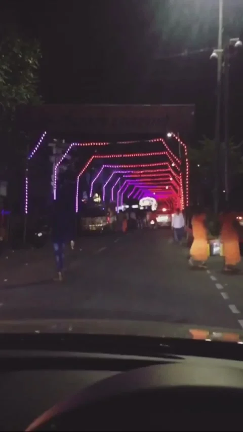 Car drive in a lighting Road crowded celebrations Stock Footage 137087895