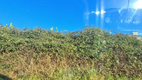 Car Drive Through British Rural Countryside Farms and Landscape Stock Footage 324783173