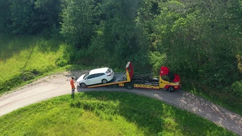 Car driven off the road is loaded on a tow truck Stock Footage 161109916