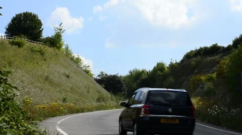Car driven up a winding road Stock Footage 8510603