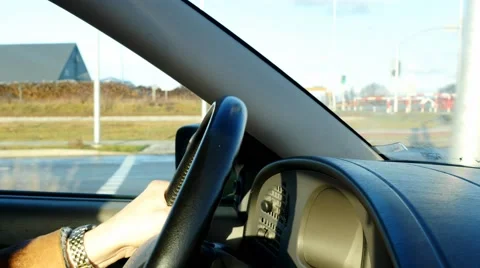 Car Driver drive an auto and making some turns with steering wheel close up Stock Footage 63034691