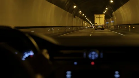 Car Driver driving through a Tunnel. Close Up Hand and Car Board Stock Footage 90768310