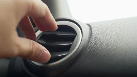 Car driver or passenger adjusting air conditioner  Video stock 142768242