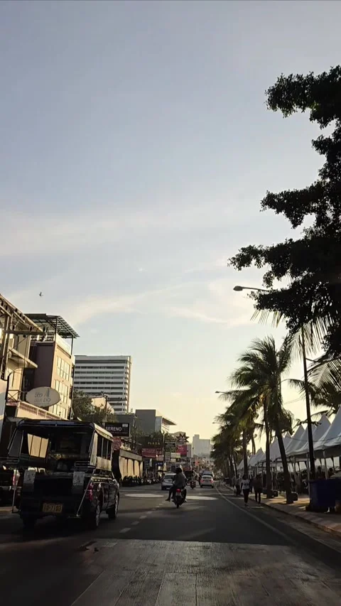 Car driver point of view, city of Pattaya street. Beach road in sunset. Driving Stock Footage 296261633