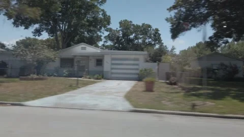 Car Driver Side Window View Of Road In Florida City Driving Down Street. Stock Footage 240600565