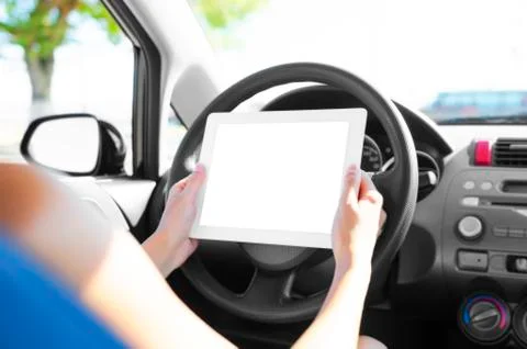 Car driver with tablet pc Stock Photos