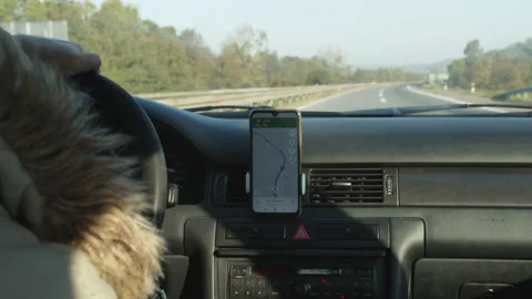 Car driver using GPS navigation on smartphone in driving on highway Stock Footage 163507317