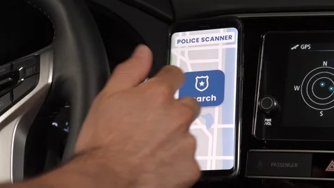 Car Driver Using a Police Scanner on His Smartphone to Detect Cops Radar Stock Footage 135101280