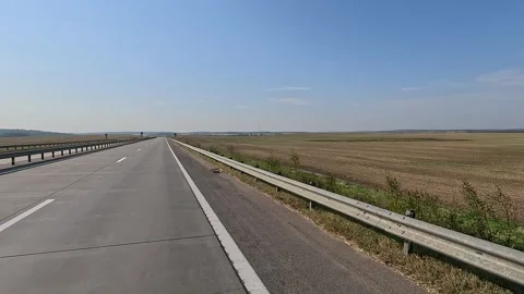 The car drives along the road on a summer day. Highways, roadside. Stock Footage 313299544