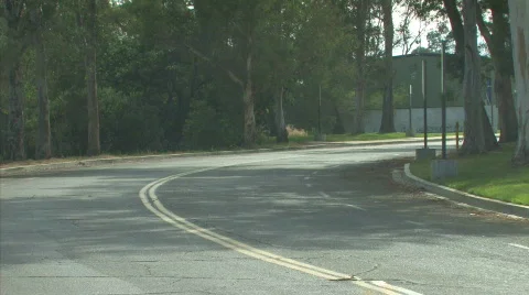 Car drives around bend 1 Stock Footage 413723