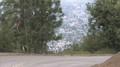 Car drives around bend 2 Stock Footage 414241
