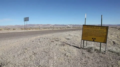 CAR DRIVES TO ATOMIC TEST SITE Stock Footage 48000201