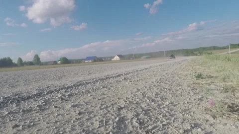 Car Drives Back on a Dirt road Video stock 139619151