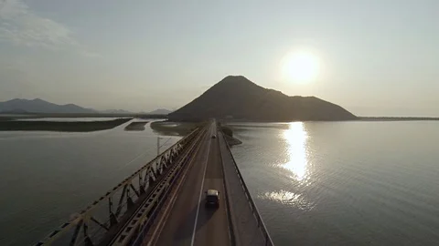 Car Drives By The Bridge Camera Backwards - Aerial Shot Stock Footage 90090298