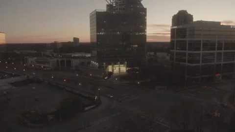 A Car drives down a desolate and empty Atlanta street at Sunrise Stock Footage 229351830