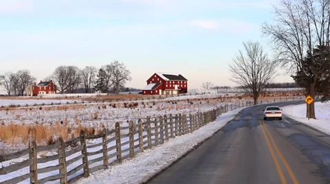 Car Drives Down Rural Road in Winter Stock Footage 35720787