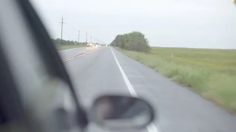 Car Drives Down Tropical Marshy Road Stock Footage 204991920