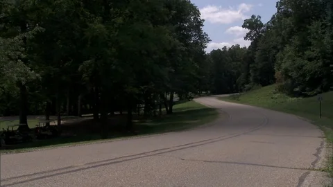 Car Drives Down Winding Road Stock Footage 88387121
