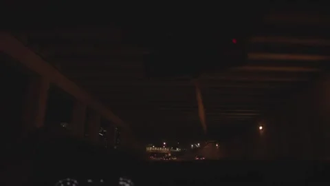 Car Drives Out from Under an Overpass Stock Footage 229351826