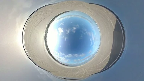 Car drives over sandy beach, North Sea, VR, Tiny planet effect Stock Footage 117721931
