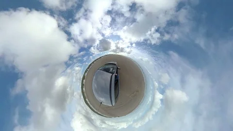 Car drives over sandy beach with bath houses, North Sea, VR Stock Footage 117725825
