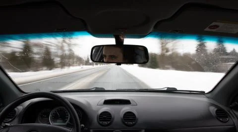 Car drives on the road during the daytime inside view Foto stock
