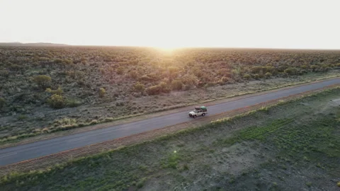 A Car Drives Through a Field Stock Footage 295027057