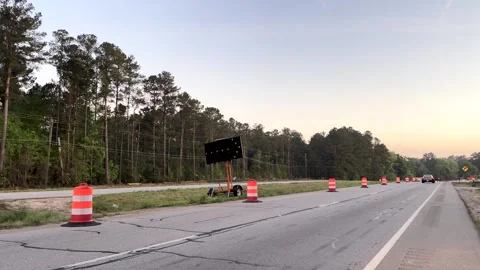 A car drives through a highway construction zone Stock Footage 185165350