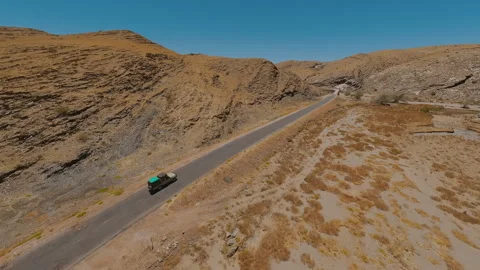 The Car Drives Through the Mountains Stock Footage 297577965