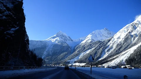 Car drives through the mountains in winter Stock Footage 129722017