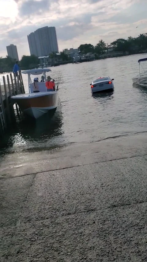 Car Drives into Water at Boat Ramp Almos... | Stock Video | Pond5