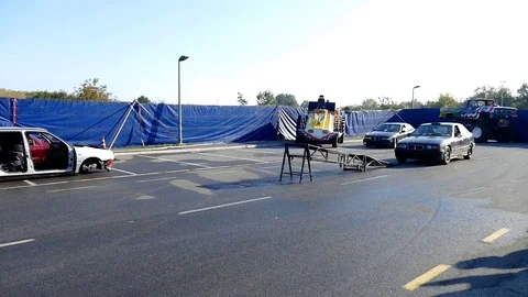 Car Driving On 2 Wheels Between People Video stock 81629357