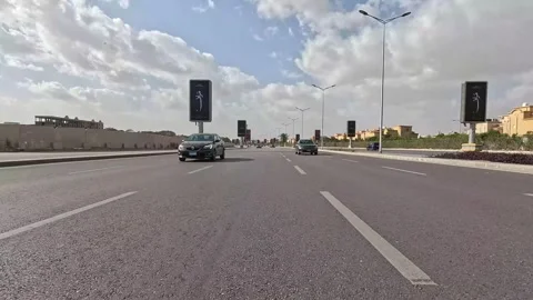 Car Driving Across District Roads New Cairo Showing Buildings Traffic And Stock Footage 329659014